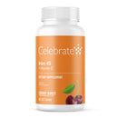 Supplement bottle labeled 'Celebrate' with cherry illustration on an orange background