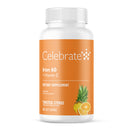 Supplement bottle labeled 'Celebrate' with iron and vitamin C on an orange background